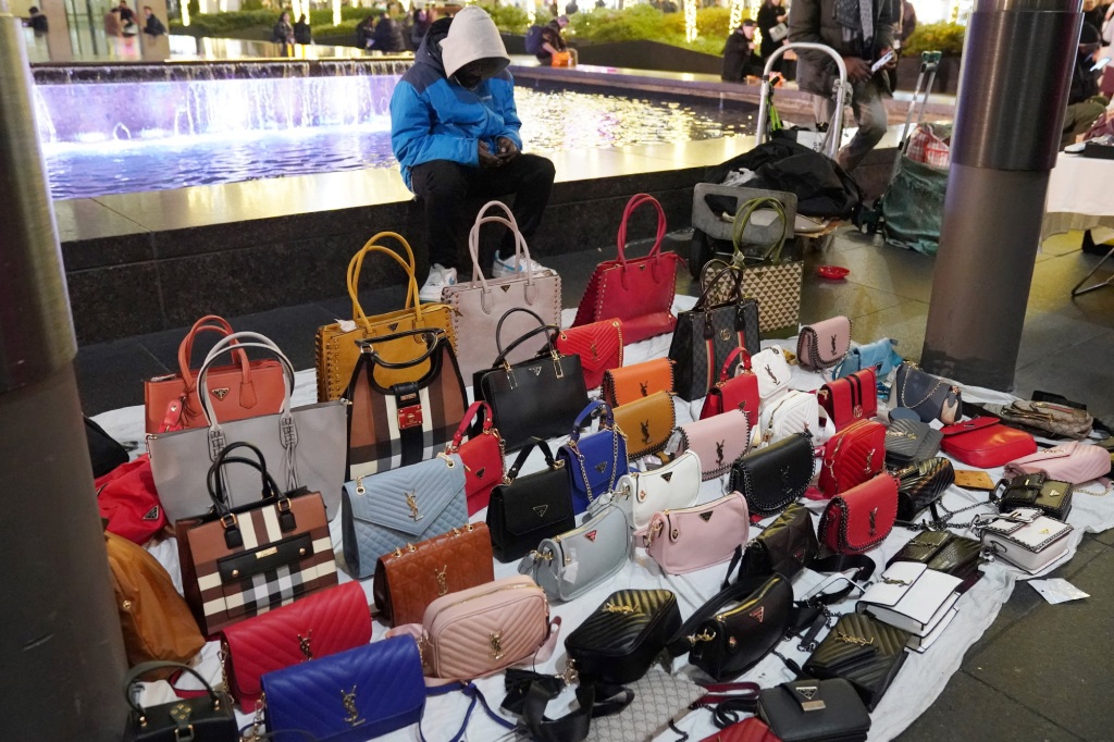 Countless unlicensed street vendors have taken over blocks of newyork's chinatown selling replica designers bags