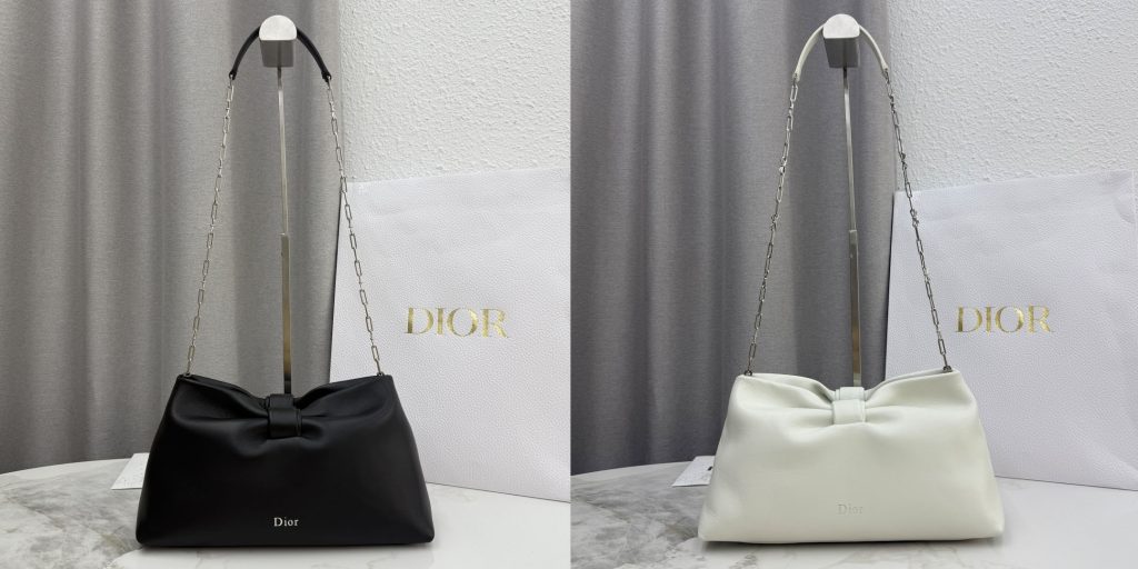 Black and Cream Replica Dior Bow Bag — luxury handbag with signature bow detail, displayed with a branded dust bag
